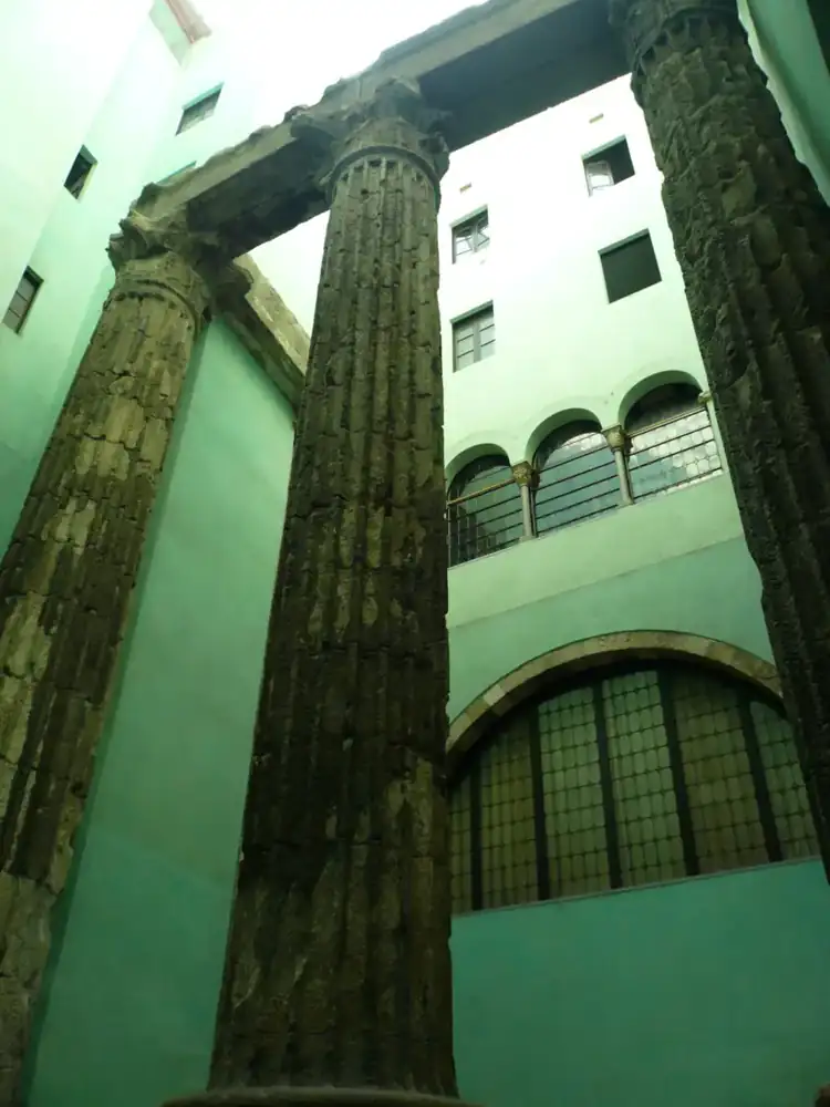 The columns of the Temple of Augustus in a courtyard