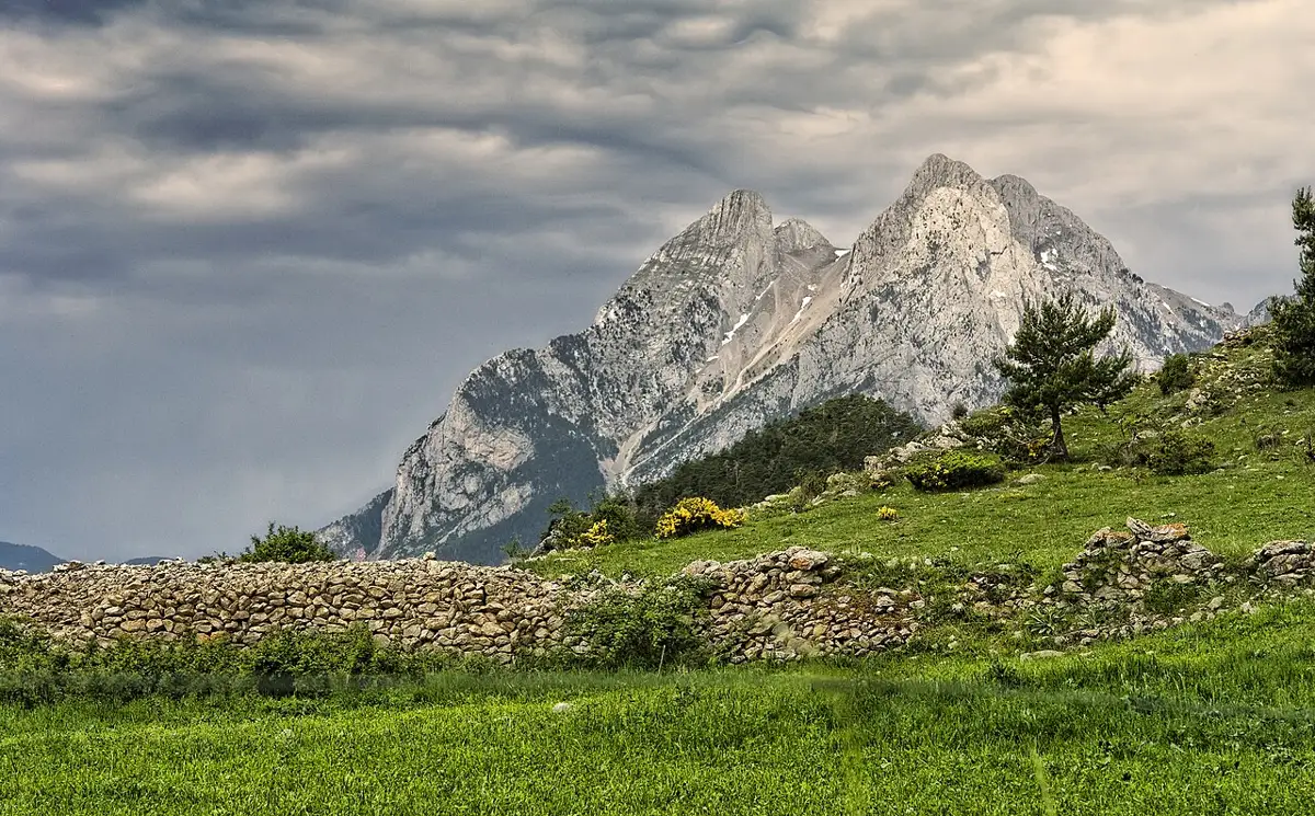 The twin peaks of Pedraforca above the meadows of Berguedà
