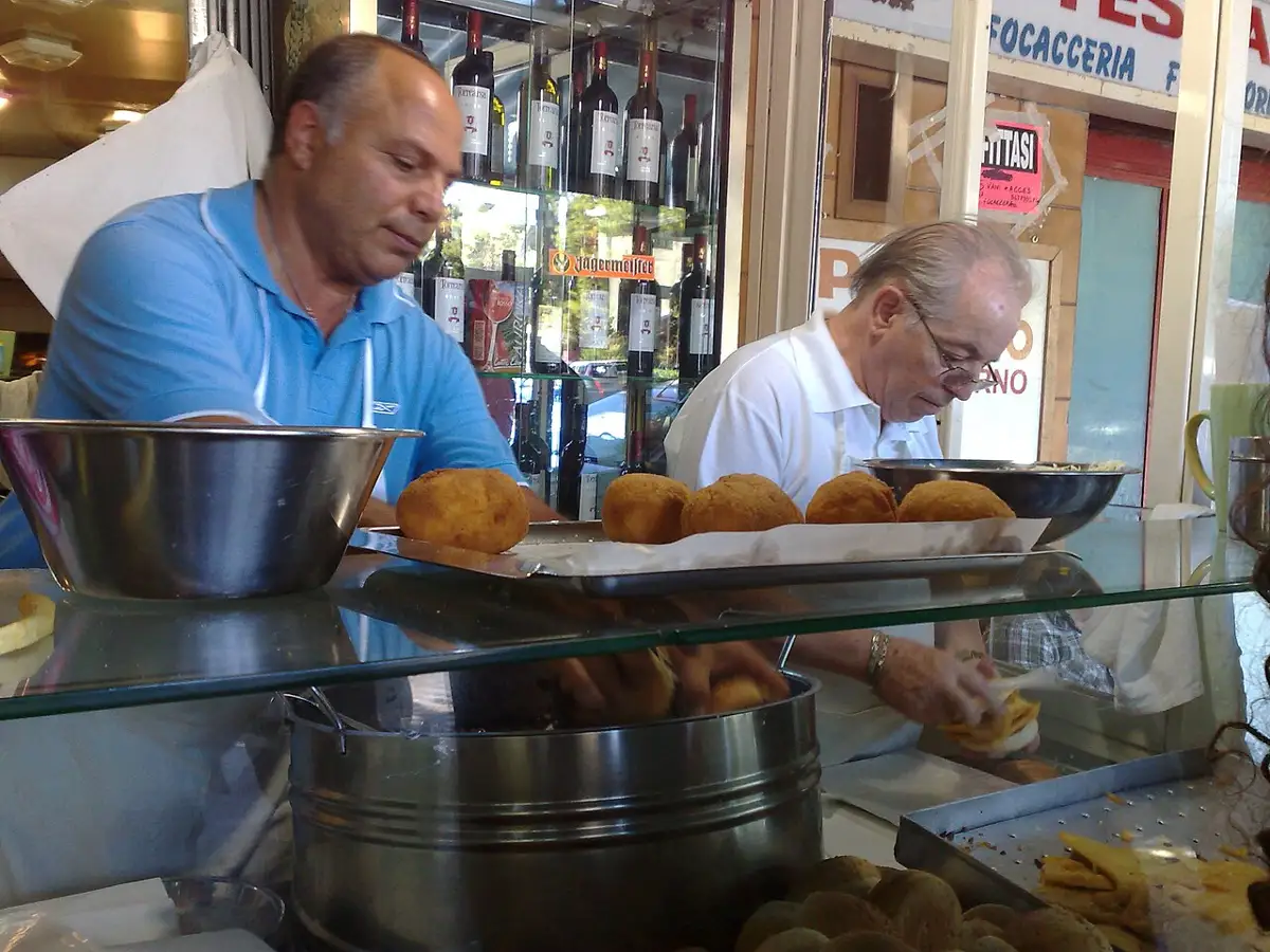 Arancine and panelle at the counter of a Palermo focacceria